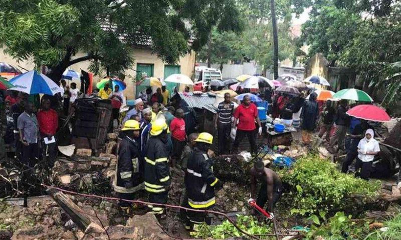 Rescuers pull bodies of people killed after a wall collapsed on a house in Mbaraki, Mombasa, May 8, 2017.