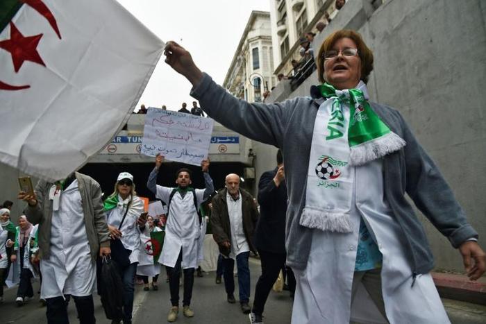 Algerian medics join a protest in the capital demanding that ailing President Abdelaziz Bouteflika step down after 20 years in power
