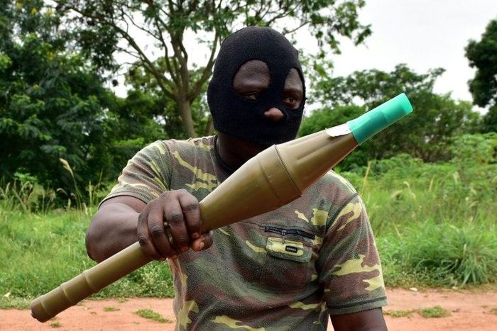 A mutinous soldier holds an RPG rocket launcher inside a military camp in Ivory Coast's second city Bouake, where the rebellion first erupted in January