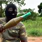 A mutinous soldier holds an RPG rocket launcher inside a military camp in Ivory Coast's second city Bouake, where the rebellion first erupted in January