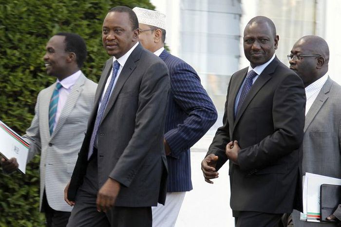 Kenya's President Uhuru Kenyatta (front L) and his Deputy William Ruto (front R) leave the State House after Kenyatta's case at the International Criminal Court (ICC) was dropped, in the capital Nairobi in this December 5, 2014.