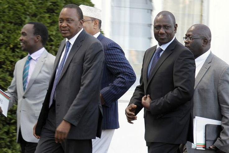 Kenya's President Uhuru Kenyatta (front L) and his Deputy William Ruto (front R) leave the State House after Kenyatta's case at the International Criminal Court (ICC) was dropped, in the capital Nairobi in this December 5, 2014.