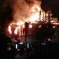 Flames are seen as firefighters try to control a fire at a school in Adana, southern Turkey, on November 29, 2016 that killed 12 people
