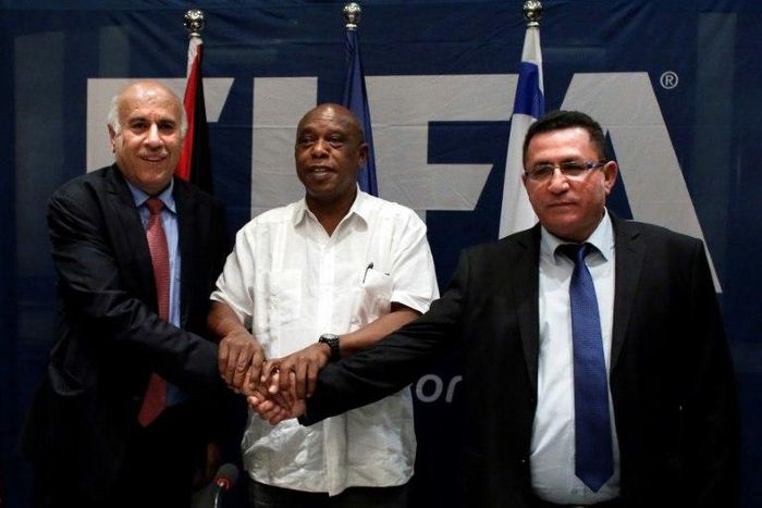 (L-R) Palestinian Football Association president Jibril Rajoub, South African official Tokyo Sexwale and president of the Israeli Football Federation, Ofer Eini are seen together in December 2015