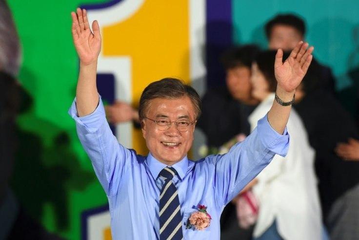 Pro-democracy activist Moon Jae-In, the projected winner of South Korea's presidential election shown at a campaign rally, backs engagement with the nuclear-armed North