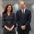 Britain's Prince William and his wife Kate pose in front of the Eiffel Tower during a visit to Paris on March 18, 2017. Six media representatives will go on trial Tuesday over the publication of Kate sunbathing topless in France