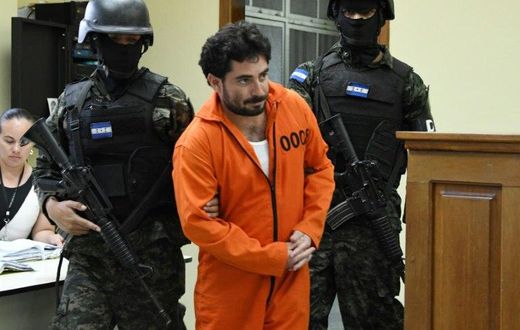 Police escort Plutarco Antonio Ruiz after he was found guilty of the 2014 murder of then Miss Honduras Maria Jose Alvarado, 19, and her sister Sofia Trinidad Alvarado, 23