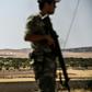 A Turkish soldier stands guard in the Turkish Syrian border city of Karkamis