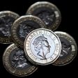 Newly issued 12-sided £1 (one pound) coins pictured in London on March 28, 2017, the day they entered UK circulation