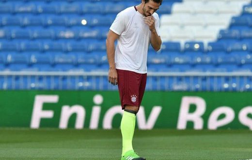 Bayern Munich's defender Mats Hummels looks down and wipes his face during a training session at the Santiago Bernabeu stadium in Madrid in Madrid on April 17, 2017