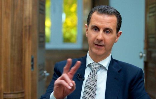 A handout picture released by the Syrian presidency's press office shows Syrian President Bashar al-Assad during an interview with AFP in the capital Damascus on April 12, 2017
