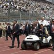 Pope Francis is surrounded by security before the start of a mass on April 29, 2017 at a stadium in Cairo