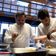 Michel Troisgros (L) cooks with his sons Cesar (R) and Leo in the new Troisgros restaurant, a veritable shrine to France's haute cuisine