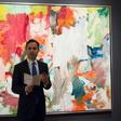 A Christie's official speaks in front of "Untitled XXV" by Willem de Kooning in New York during a press preview