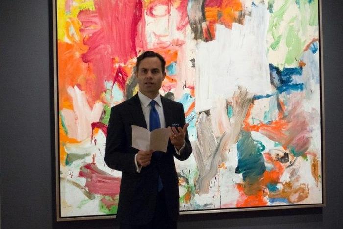 A Christie's official speaks in front of "Untitled XXV" by Willem de Kooning in New York during a press preview