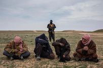 Men who fled the last village held by the Islamic State wait to be questioned by coalition forces in Deir al-Zour Province.CreditIvor Prickett for The New York Times