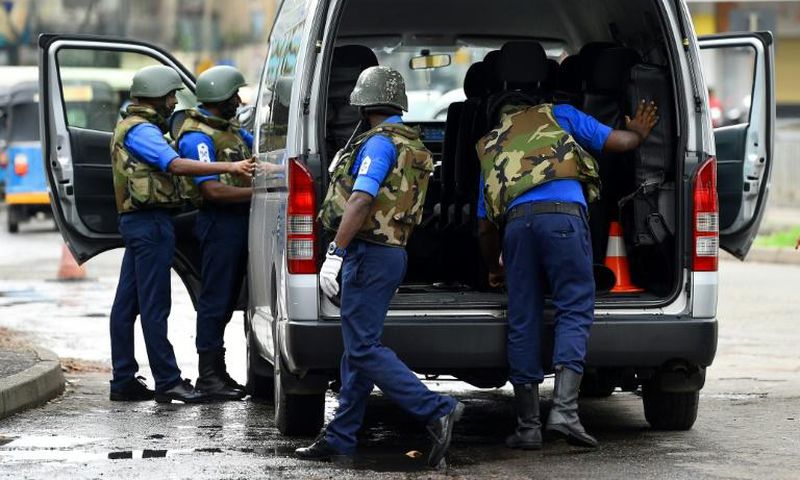 Sri Lankan soldiers inspect a van at a checkpoint in Colombo on May 3,2019, after a series of bomb blasts targeting churches and luxury hotels on Easter Sunday in Sri Lanka. Sri Lanka's Catholic Church scrapped plans to resume Sunday services following...