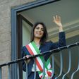 Newly elected mayor of Rome, Virginia Raggi, waves to people from the balcony of Rome's city hall on June 23, 2016, after her official investiture