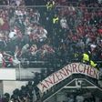 Riot police clash with Bayern fans in the tribunes during the UEFA Champions League quarter-final match against Real Madrid at the Santiago Bernabeu stadium in Madrid in Madrid on April 18, 2017