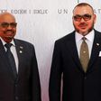Sudanese President Omar al-Bashir (L) and Morocco's King Mohammed VI pose for a photograph as they arrive for the COP22 Climate Change Conference in Marrakesh on November 15, 2016