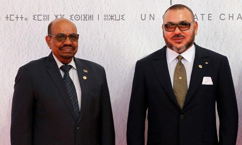 Sudanese President Omar al-Bashir (L) and Morocco's King Mohammed VI pose for a photograph as they arrive for the COP22 Climate Change Conference in Marrakesh on November 15, 2016