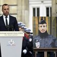 Etienne Cardiles -- stands beside a portrait of his slain partner Xavier Jugele -- during a ceremony to honour the policeman who was killed by a jihadist gunman in April 2017