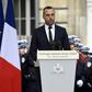 Etienne Cardiles -- stands beside a portrait of his slain partner Xavier Jugele -- during a ceremony to honour the policeman who was killed by a jihadist gunman in April 2017
