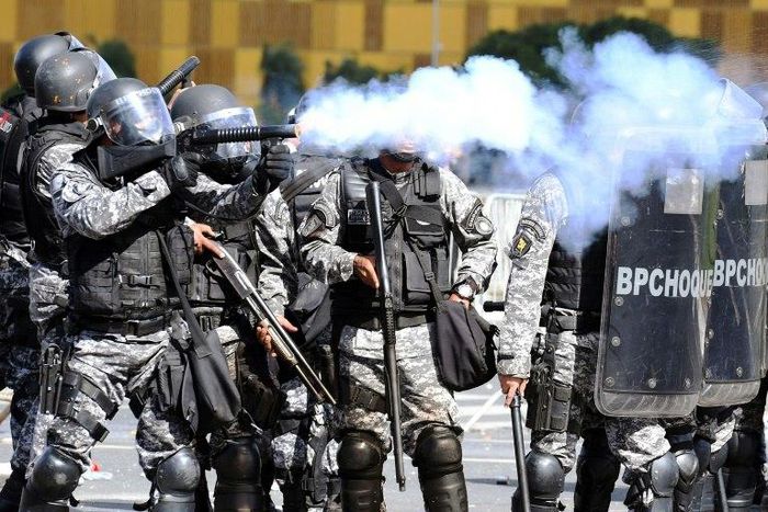 Riot police clash with demonstrators demanding the resignation of embattled President Michel Temer