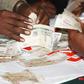 Money in Kenyan currency changing hands (Twitter)