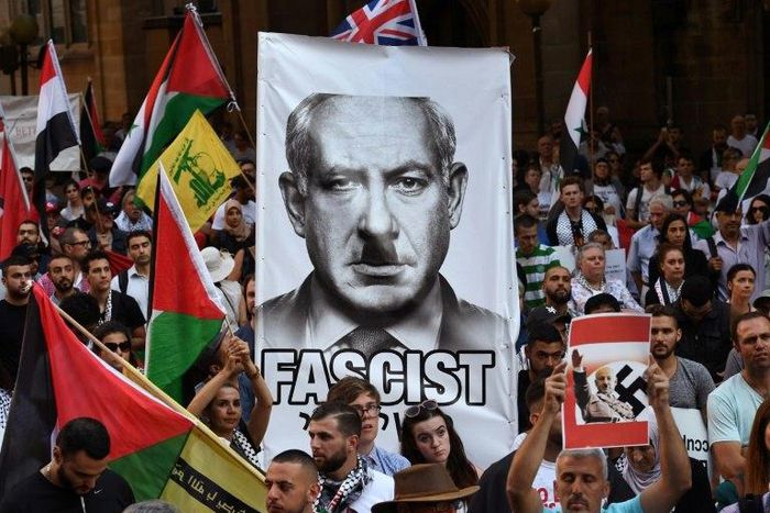 Pro-Palestinian activists demonstrate against a visit by Israel PM Benjamin Netanyahu, during a protest rally in Sydney, on February 23, 2017