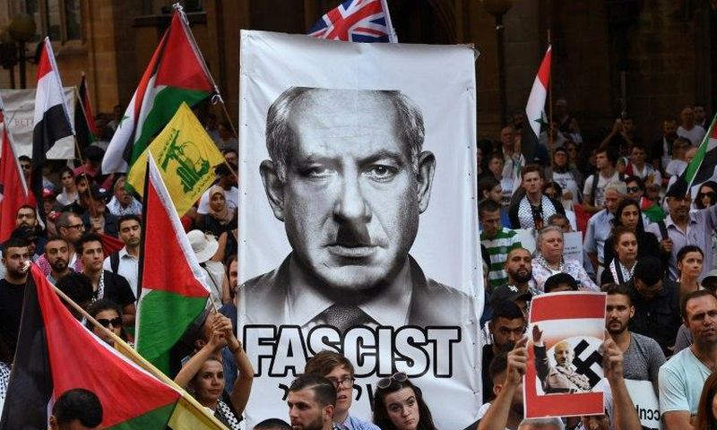 Pro-Palestinian activists demonstrate against a visit by Israel PM Benjamin Netanyahu, during a protest rally in Sydney, on February 23, 2017