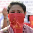 Members and supporters of the communist party of the Philippines' armed group, the New People's Army (NPA) march toward the peace arch for a protest near Malacanang Palace in Manila on March 31, 2017