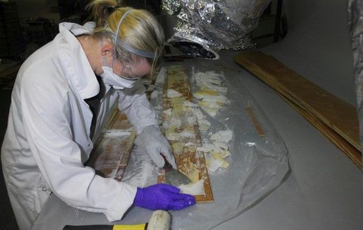 Crystal methamphetamine is removed from planks of wood at a warehouse in Nunawading, east of Melbourne, Australia, where it was hidden in 70 boxes of floorboards shipped from China