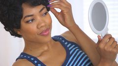 woman on mirror (Videoblocks)
