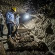 Egyptian Antiquities Minister Khaled el-Enany (C) speaks to media on May 13, 2017, in front of mummies discovered in catacombs in Touna el-Gabal district, Minya province, in central Egypt