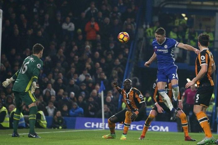 Chelsea's Gary Cahill jumps to head teh ball past Hull City's goalkeeper Eldin Jakupovic during the match at Stamford Bridge in London on January 22, 2017