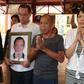 Shen Jui-chang (C), who was the chief engineer on a fishing boat that was seized south of the Seychelles in March 2012, prays at Hsing Tian Kong temple in Taipei City on October 26, 2016