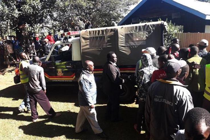 File image of Police Officers and members of the public at a scene of crime
