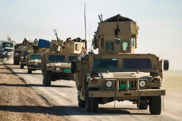 Iraqi tanks and armoured vehicles advance towards the village of Sheikh Younis, after the offensive to retake the western side of Mosul commenced on February 19, 2017