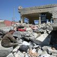 An Iraqi man in the rubble of destroyed houses in Mosul's al-Jadida area on March 26, 2017, after air strikes which reportedly killed civilians