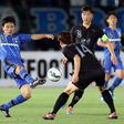 Japan's Gamba Osaka midfielder Yasuyuki Konno (L) shoots during the AFC Champions League group F match against outh Korea's Seongnam FC in Osaka, western Japan on May 6, 2015