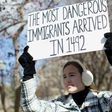 A demonstrator holds a sign near the White House to protest President Donald Trump's travel ban on six Muslim countries