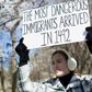 A demonstrator holds a sign near the White House to protest President Donald Trump's travel ban on six Muslim countries