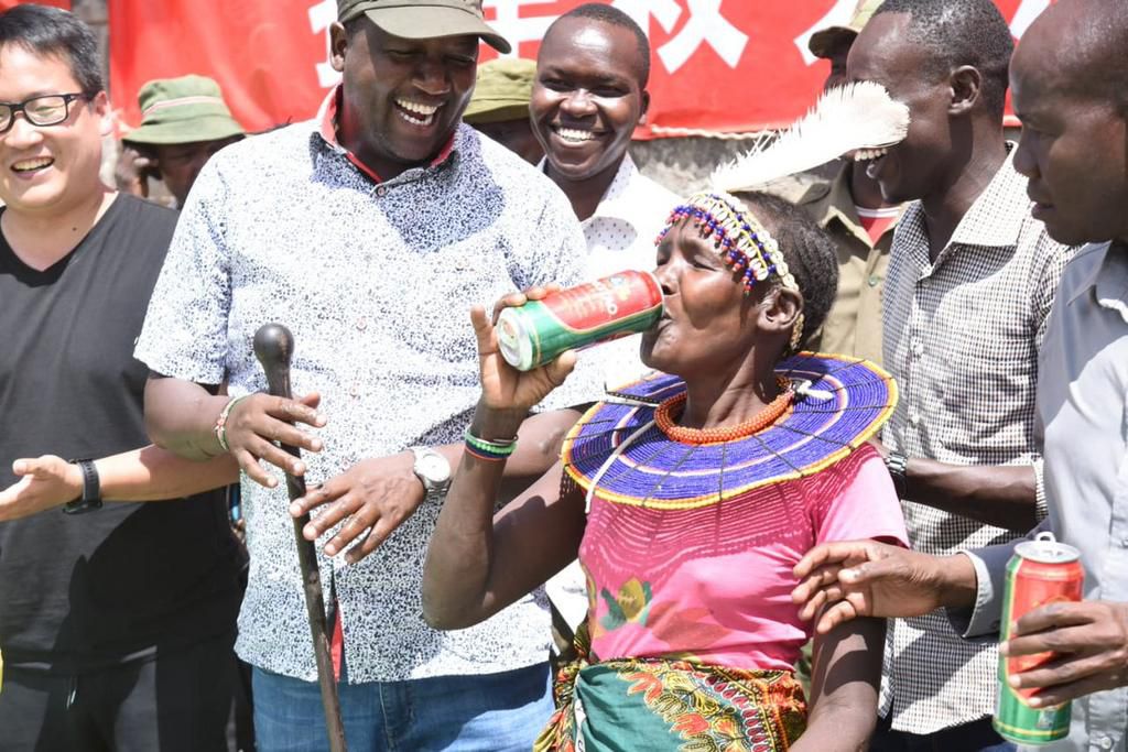 Tiaty Sub-county resident enjoys a can of the donated beer (Nation)