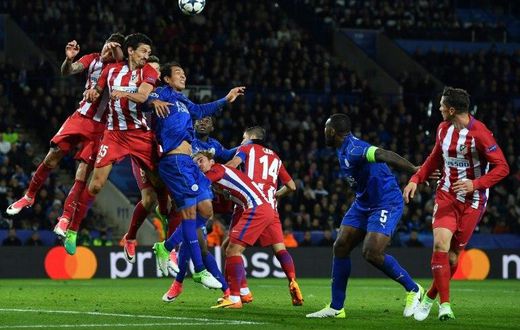 Leicester City's striker Leonardo Ulloa (3R) vies with Atletico Madrid's defender Stefan Savic (2R) during the UEFA Champions League quarter-final second leg football match April 18, 2017