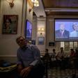 People watch a live screening of the third and final presidential debate between Republican nominee Donald Trump and Democratic nominee Hillary Clinton