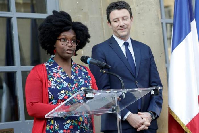 Newly appointed French government spokesperson Sibeth Ndiaye, left, and her predecessor Benjamin Griveaux at a handover ceremony in Paris on Monday
