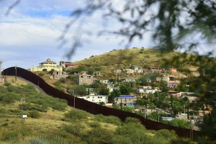 Residents of Nogales on the US-Mexico border point to their town, already divded in two by an 18-foot border wall, as an example of why Trump's wall ambitions won't work