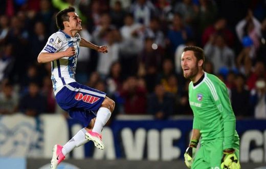 Pachuca's Hirving Lozano (L) celebrates scoring a goal against FC Dallas during their CONCACAF Champions League semi-final 2nd leg match, at the Miguel Hidalgo stadium in Pachuca, Mexico, on April 4, 2017