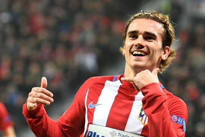Atletico Madrid's forward Antoine Griezmann celebrates after scoringl during the Champions League round of 16 first-leg football match against Bayer 04 Leverkusen February 21, 2017
